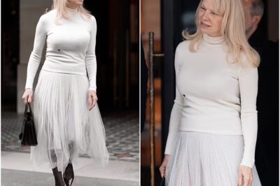 Pamela Anderson looks ethereal in a sheer white Dior skirt as she steps out of her hotel after dividing This Morning viewers with a kooky outfit choice