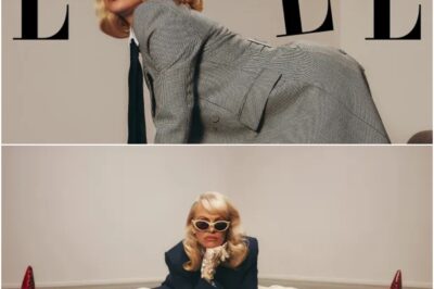 SITTING PRETTY Pamela Anderson, 57, shows off her endless legs in a suit for Elle after Oscars snub