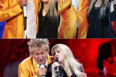 “When Stevie Nicks And Rod Stewart Took The Stage In April 2011, The Crowd Instantly Knew They Were About To Witness Something Extraordinary. As The Opening Chords Of Leather & Lace Filled The Air, Stevie’s Hauntingly Beautiful Voice Blended Seamlessly With Rod’s Iconic Raspy Grit, Creating A Spellbinding Contrast. Their Chemistry Was Undeniable, Their Harmonies Effortless, Transforming The Song Into A Deeply Emotional And Intimate Exchange. The Audience Swayed, Completely Enchanted By The Magic Unfolding Before Them. As The Final Note Hung In The Air, Thunderous Applause Erupted—A Sure Sign That They Had Just Experienced Two Legends At Their Peak. Don’t Miss This Unforgettable Duet—Watch The Video Below!”